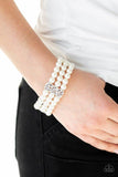 Paparazzi Ritzy Ritz - White  -  Infused with ornate silver frames, row after row of white pearls are threaded along stretchy bands around the wrist for a refined flair.
