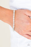 Paparazzi Out Like A SOCIALITE - White - Bracelet
Featuring square silver fittings, a row of pearly white beads connect with a row of glittery white rhinestones for a modern twist. Features an adjustable clasp closure.