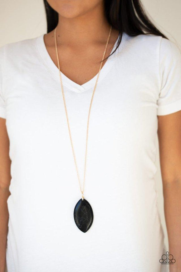 Paparazzi Santa Fe Simplicity - Black  -  Chiseled into a tranquil almond-shape, an oversized black stone pendant swings from the bottom of a lengthened gold chain in a seasonal fashion. Features an adjustable clasp closure.

