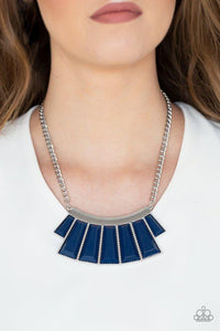 Paparazzi Glamour Goddess - Blue Featuring the deep shade of Evening Blue, faceted emerald style beads are pressed into a hammered silver plate. Featuring flared bottoms, the colorful beads fan out below the collar for a fierce finish. Features an adjustable clasp closure.

