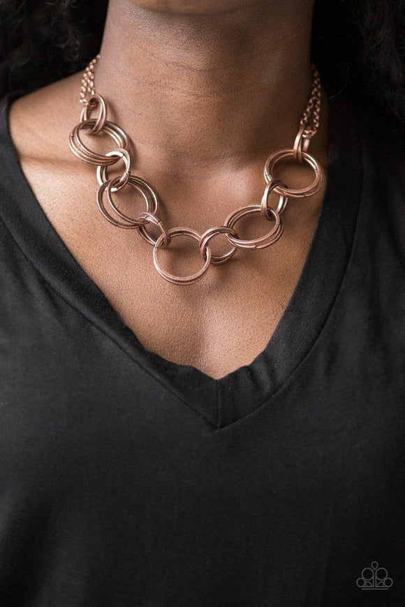 Paparazzi Jump Into The Ring - Copper Brushed in an antiqued shimmer, doubled and tripled copper hoops link below the collar for a bold industrial look. Features an adjustable clasp closure.

