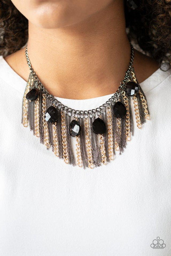 Paparazzi Vixen Conviction - Multi  -  Infused with a row of faceted black teardrops, mismatched strands of gold and gunmetal chains stream from the bottom of a glistening gunmetal chain, creating a statement-making fringe below the collar. Features an adjustable clasp closure.
