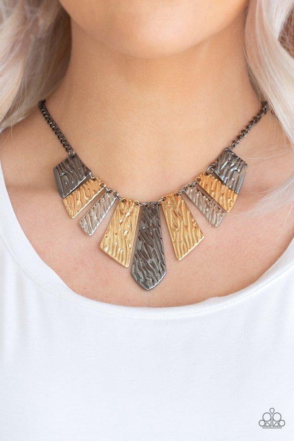 Paparazzi Texture Tigress - Multi Embossed in rippling patterns, a collection of angular silver, gunmetal, and gold plates swing from the bottom of a glistening gunmetal chain, creating an edgy geometric fringe below the collar. Features an adjustable clasp closure.

