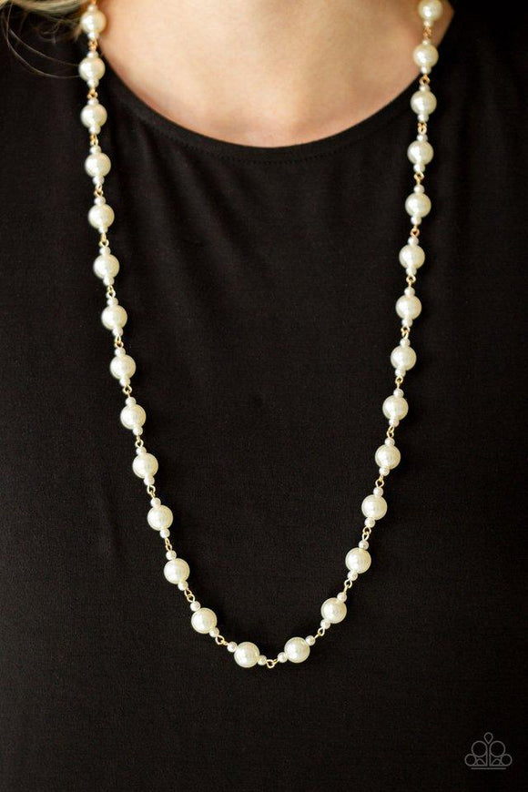 Paparazzi Behind The Scenes - Gold  -  A collection of dainty and classic white pearls link across the chest in a timeless fashion. Features an adjustable clasp closure.

