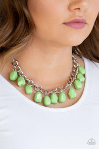Paparazzi Take The COLOR Wheel - Green A collection of round and faceted green beads swings from the bottom of a bulky silver chain below the collar, creating a vivacious fringe. Features an adjustable clasp closure.

