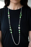 Paparazzi Marina Majesty - Green A collection of faceted silver, crystal-like green, polished green, and silver beads give way to layers of shimmery silver chains for a whimsical look. Features an adjustable clasp closure.

