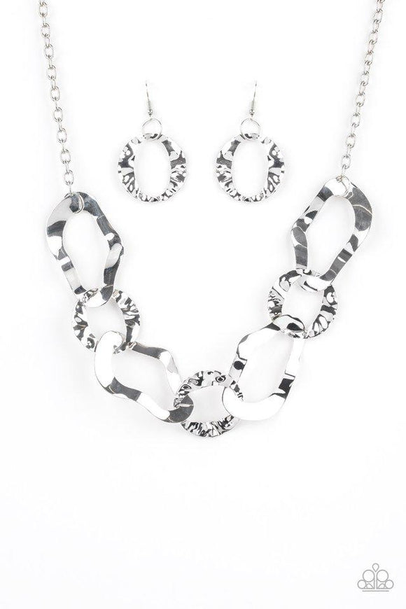 Paparazzi Capital Contour - Silver Brushed in a high-sheen finish, warped silver links connect below the collar for an edgy statement. Features an adjustable clasp closure.

