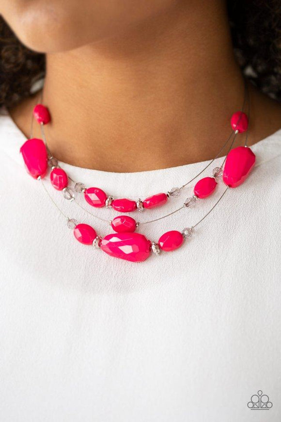 Paparazzi Radiant Reflections - Pink  -  Infused with dainty metallic accents, a collection of faceted pink and sparkling crystal-like beads are threaded along invisible wires below the collar for a whimsically layered look. Features an adjustable clasp closure.
