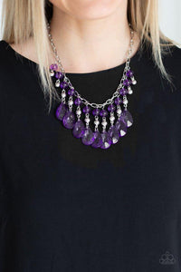 Paparazzi Beauty School Drop Out - Purple Faceted crystal-like teardrops in a gorgeous purple hue dance along the neckline with shiny silver beads and smaller purple crystal-like beads creating dramatic flair. Features an adjustable clasp closure.

