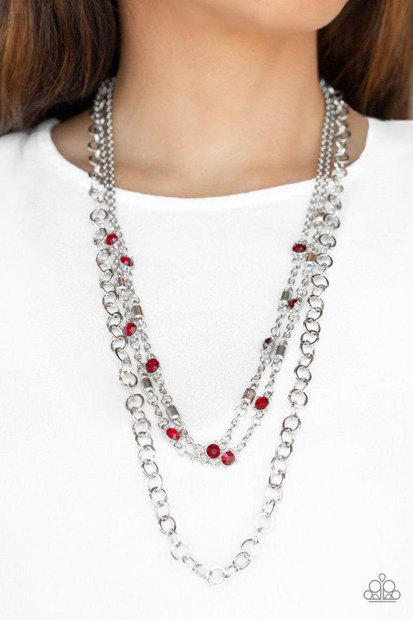 Paparazzi Metro Mixer - Red  -  Dotted with glassy red rhinestones and glistening silver accents, a collision of mismatched silver chains layer down the chest for a refined flair. Features an adjustable clasp closure.
