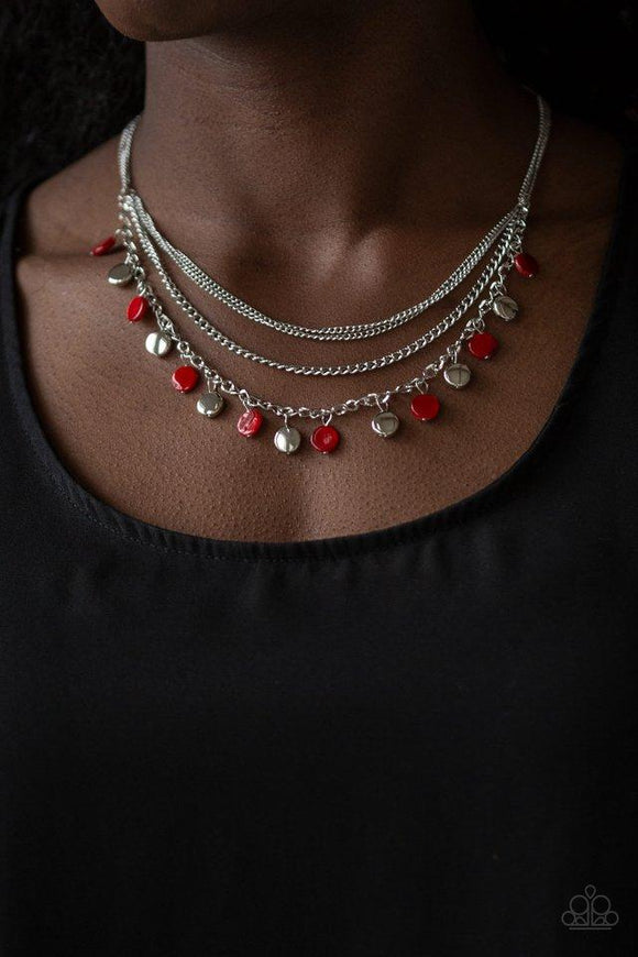 Paparazzi Beach Flavor - Red  -  Mismatched silver chains layer below the collar. Shell-like red beads and shiny silver beads trickle from the lowermost chain, creating an iridescent fringe. Features an adjustable clasp closure.
