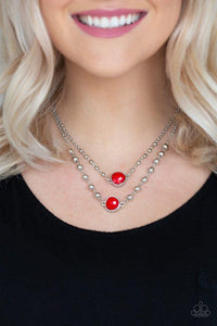 Paparazzi Colorfully Charming - Red  -  Featuring asymmetrical teardrop shapes, faceted red beads layer below the collar. Dainty silver beads adorn the uppermost silver strand, while slightly larger silver beads dot the lowermost strand for a whimsical finish. Features an adjustable clasp closure.
