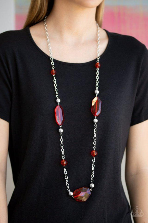 Paparazzi Crystal Charm - Red A collection of glassy red beads, shiny silver beads, and oversized faceted crystal-like beads trickle along a shimmery silver chain across the chest for a whimsically refined look. Features an adjustable clasp closure.

