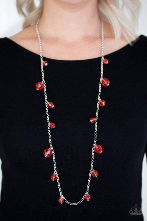 Paparazzi GLOW Rider - Red Varying in size, a collection of glassy red crystal-like beads trickle down a shimmery silver chain across the chest for a whimsical look. Features an adjustable clasp closure.


