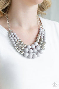 Paparazzi Dream Pop - Silver Gradually increasing in size near the center, a collection of gray and silver beads layer below the collar in a statement making fashion. Features an adjustable clasp closure.


