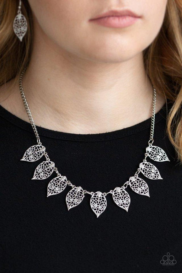 Paparazzi Leafy Lagoon - Silver Swirling with dotted filigree, dainty silver leaf frames swing from the bottom of a glistening silver chain, creating a whimsical fringe below the collar. Features an adjustable clasp closure.

