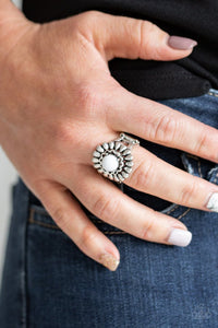 Paparazzi Poppy Pep - White - Ring  -  A shiny white bead is nestled atop a stacked floral frame, creating a colorful flower atop the finger. Features a stretchy band for a flexible fit.

