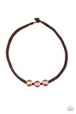 Paparazzi Pedal To The Metal - Copper - Necklace  -  Three antiqued copper beads are knotted in place along a brown braided cord below the collar for an urban look. Features a button loop closure.
