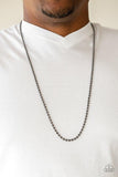 Paparazzi Cadet Casual - Black A dainty strand of gunmetal ball chain drapes across the chest for a causal look. Features an adjustable ball chain connector.


