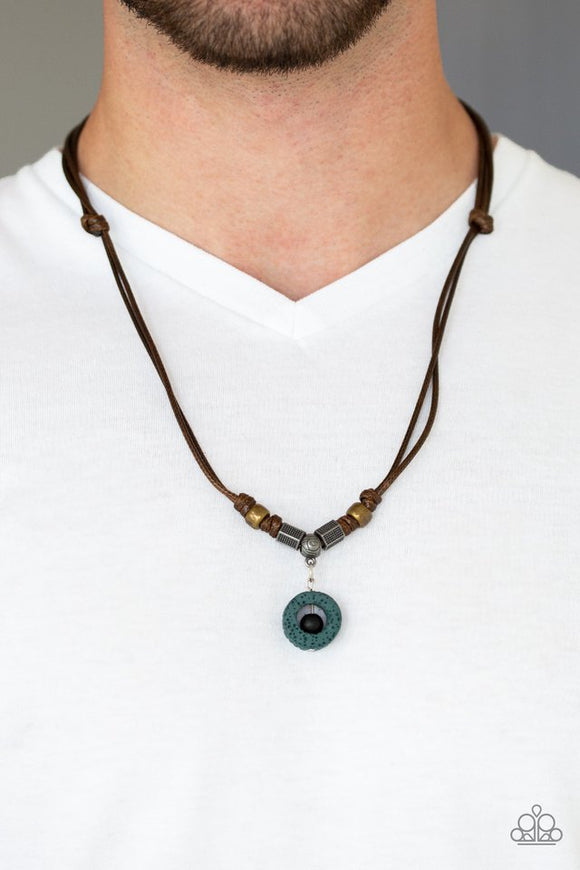Paparazzi Tiki Thunder - Green - Necklace  -  A collection of brass and silver accents are knotted in place below the collar. A black wooden bead is threaded along a rod in the center of a green lava rock pendant for a seasonal flair. Features an adjustable sliding knot closure.

