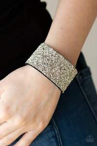 Paparazzi The Halftime Show - Silver  -  Crushed bits of silver accents are sprinkled along the center of a thick black suede band, creating a blinding shimmer around the wrist. Features an adjustable snap closure.
