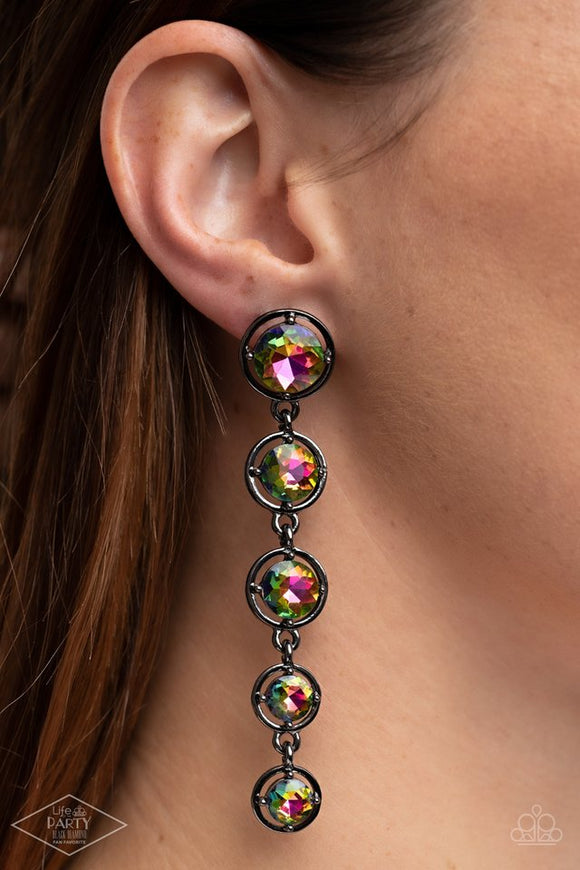 Paparazzi Drippin In Starlight - Multi - Earrings  -  Featuring sleek gunmetal fittings, faceted rainbow gems gradually decrease as they trickle from the ear for a glamorous look. Earring attaches to a standard post fitting.

