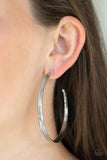 Paparazzi Wheelhouse - Silver  -  Three flat silver bars curl around the ear, boldly stacking into an edgy hoop. Hoop measures approximately 2 1/2" in diameter.
