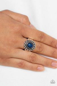 Paparazzi Please and Thank You - Blue An oval blue bead is pressed into a dainty silver frame radiating with antiqued silver studs for a whimsical look. Features a dainty stretchy band for a flexible fit.
