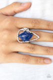 Paparazzi Get The Point - Blue An abstract blue stone is nestled inside a hammered silver triangle, creating an artisan inspired frame atop the finger. Features a stretchy band for a flexible fit.
