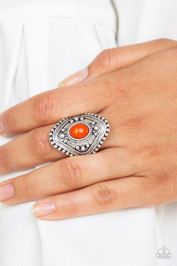 Paparazzi Rogue Ramble - Orange A hearty orange bead is pressed into the center of a thick silver frame radiating with studded texture for a bold tribal look. Features a stretchy band for a flexible fit.
