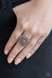 Paparazzi Mandala Magnificence - Orange Glittery orange rhinestones are sprinkled across a shimmery floral center, creating a whimsical mandala-like frame atop the finger. Features a stretchy band for a flexible fit.
