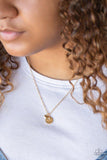 Paparazzi Worlds Best Mom - Gold Dotted with a dainty white rhinestone, a shimmery gold disc stamped with the word, "mom", joins a dainty gold heart below the collar for a whimsical look. Features an adjustable clasp closure.

