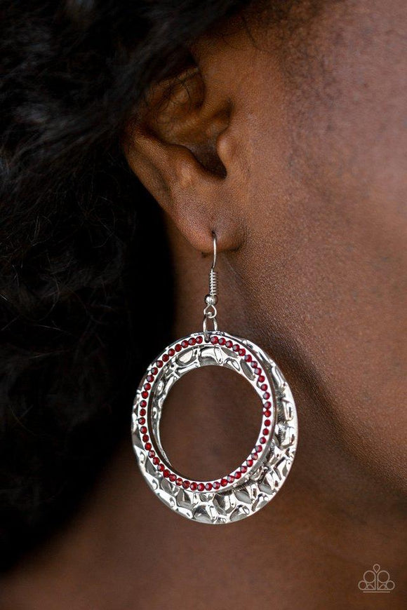 Paparazzi Cinematic Shimmer - Red Encrusted in fiery red rhinestones, a glittery silver hoop links with a thick silver hoop embossed in metallic pebble-like patterns, creating a refined lure. Earring attaches to a standard fishhook fitting.

