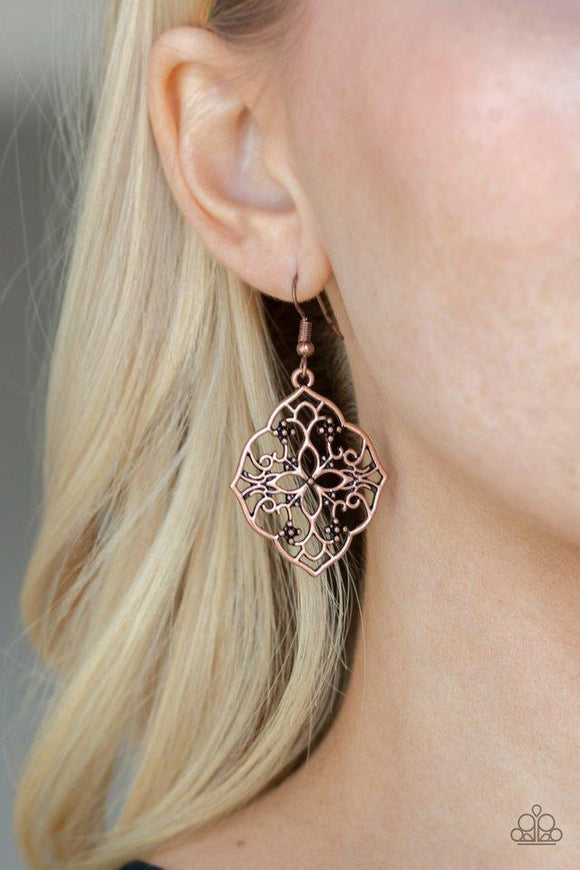 Paparazzi Garden Mandala - Copper Brushed in an antiqued shimmer, glistening copper filigree swirls into a whimsical floral frame for a seasonal look. Earring attaches to standard fishhook fitting.

