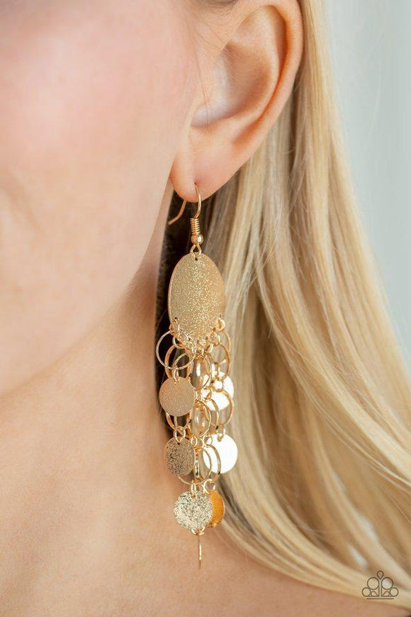 Paparazzi Turn On The BRIGHTS - Gold A collection of glistening gold rings and dainty gold discs cascade from the bottom of a shimmery gold frame, creating a refined fringe. Earring attaches to a standard fishhook fitting.

