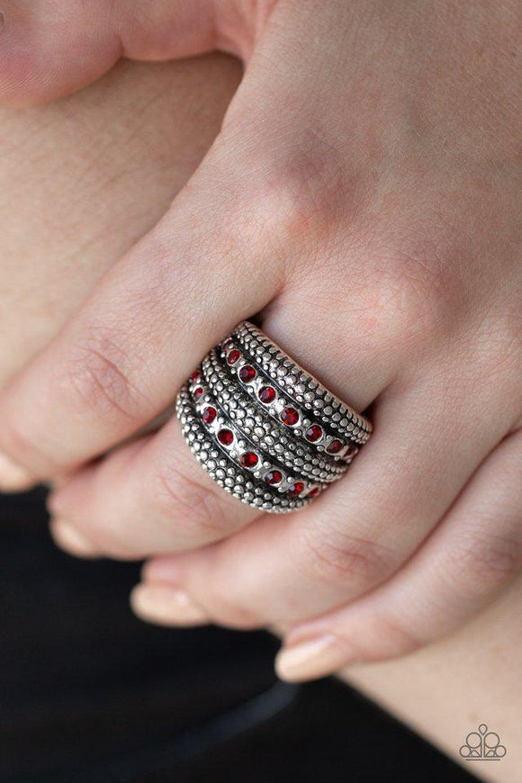 Paparazzi Girl Fight - Red Two rows of fiery red rhinestones are encrusted along a thick silver band radiating in sections of shimmery studs for a sassy look. Features a stretchy band for a flexible fit.
