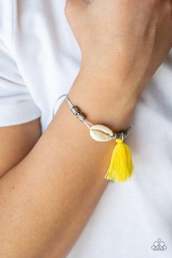Paparazzi SEA If I Care - Yellow Infused with antiqued silver beads, a yellow threaded tassel and dainty white seashell slide along strips of shiny gray cording around the wrist for a summery look. Features an adjustable sliding knot closure.

