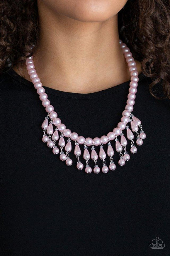 Paparazzi Miss Majestic - Pink Pearly pink teardrop beads link with classic pink pearls as they drip from a timeless strand of pink pearls. Sprinkled with dainty crystal-like accents, the refined fringe cascades below the collar for a glamorous finish. Features an adjustable clasp closure.
