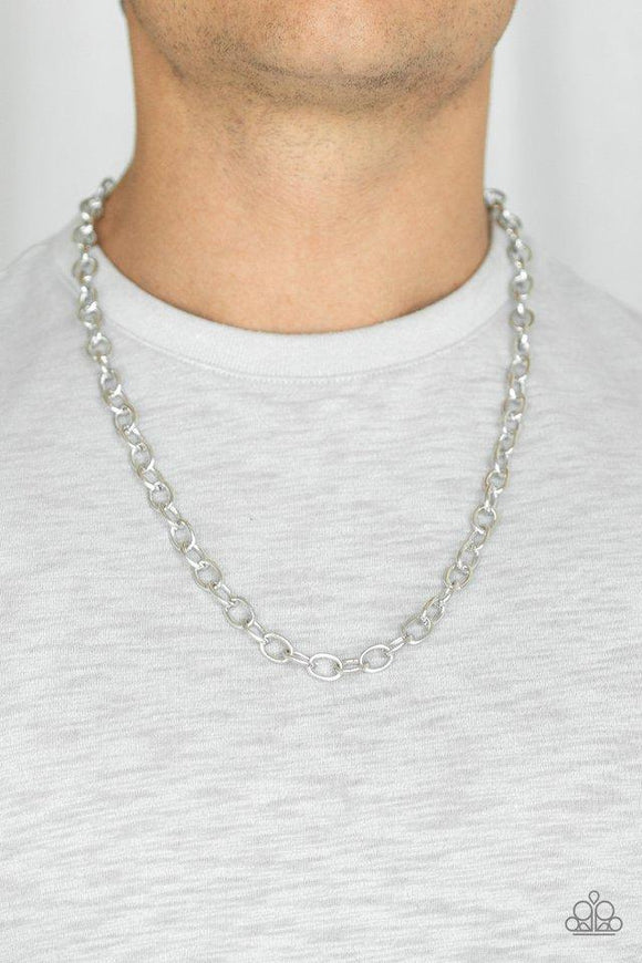 Paparazzi Courtside Seats - Silver  -  Delicately etched in subtle shimmer, a classic silver chain drapes across the chest for a casual look. Features an adjustable clasp closure.
