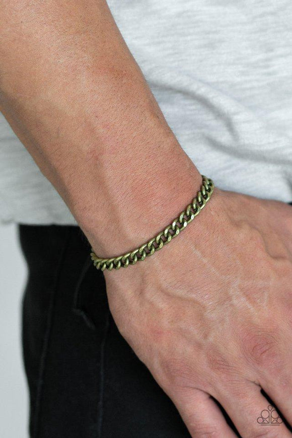 Paparazzi Goal - Brass Shiny black cording knots around the ends of a brass beveled cable chain that is wrapped across the top of the wrist for a versatile look. Features an adjustable sliding knot closure.

