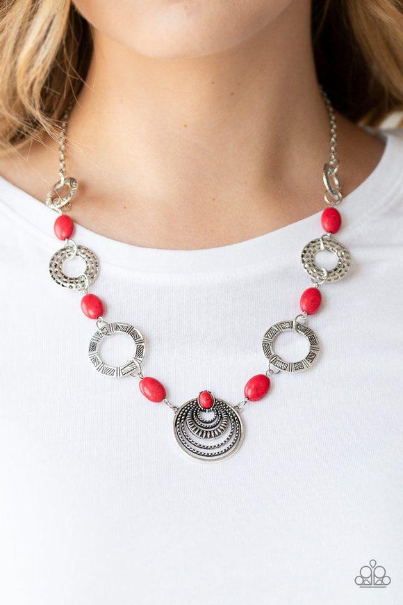 Paparazzi Zen Trend - Red  -  Hammered, stamped, and studded in tribal inspired patterns, a collection of ornate silver discs link with fiery red stones below the collar for a colorful flair. Features an adjustable clasp closure.
