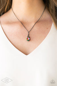 Paparazzi Timeless Trinket - Multi - Necklace  -  A shimmery gunmetal wire-like frame wraps around the top of a glittery rainbow teardrop gem, creating a timeless pendant below the collar. Features an adjustable clasp closure.
