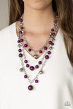Paparazzi The Partygoer - Purple - Necklace  An assortment of shiny silver, faceted silver, and shiny plum beads sporadically dot and swing from three shimmery silver chains that layer down the chest for a colorful statement-making finish. Features an adjustable clasp closure.