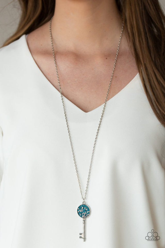 Paparazzi Key Keepsake - Blue - Necklace  -  Encrusted in glassy blue and glittery hematite rhinestones, a sparkling silver key swings from the bottom of a lengthened silver chain for a whimsical look. Features an adjustable clasp closure.
