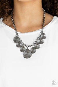 Paparazzi Texture Storm - Black Hammered in blinding shimmer, glistening gunmetal teardrops dangle from a textured gunmetal chain, creating an edgy fringe below the collar. Features an adjustable clasp closure.
