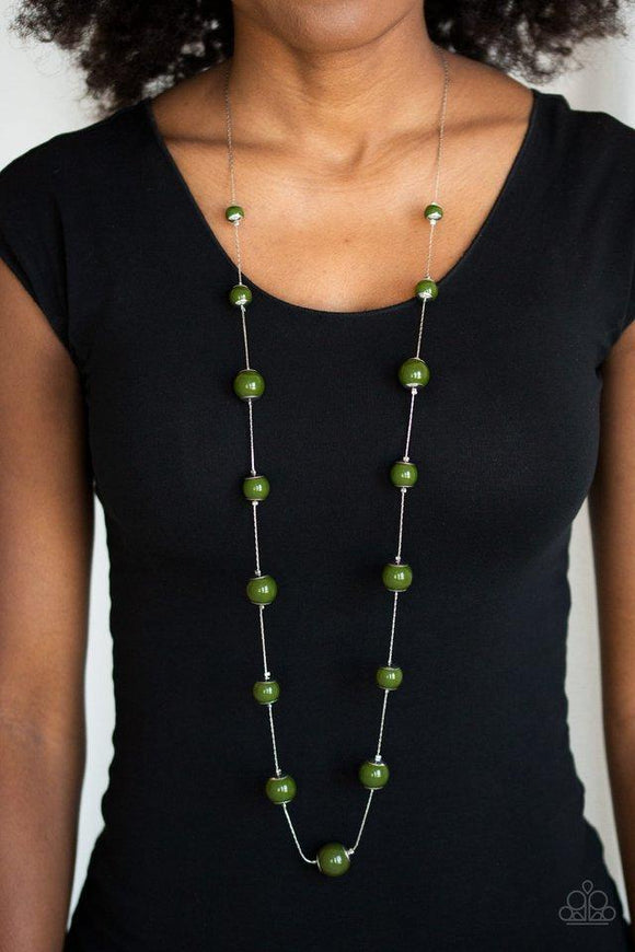 Paparazzi 5th Avenue Frenzy - Green Nestled between sleek silver fittings, timeless green beads gradually increase in size as they trickle along a dainty silver chain across the chest for a colorfully classic look. Features an adjustable clasp closure.
