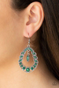 Paparazzi Malibu Mardi Gras - Green An array of faceted Eden beads are sprinkled along an oval silver frame dotted with a collection of ornate silver fittings. Featuring a sleek studded frame, a faceted Eden marquise bead swings from the top of the frame for a glamorous finish. Earring attaches to a standard fishhook fitting.
