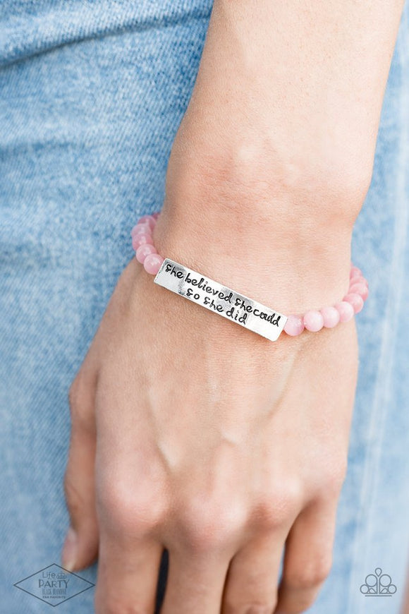Paparazzi So She Did - Pink - Bracelet  -  A collection of dainty pink cat's eye stone beads and an antiqued frame stamped in the inspirational phrase, 