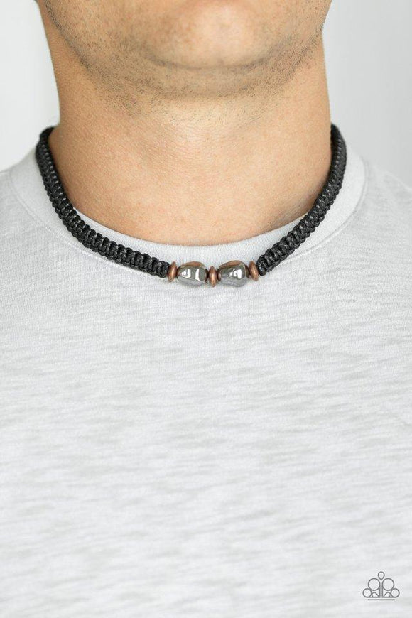 Paparazzi Urban Explorer - Copper  -  A collection of copper and gunmetal accents are knotted in place along the center of a braided cord for a seasonal look. Features a button loop closure.
