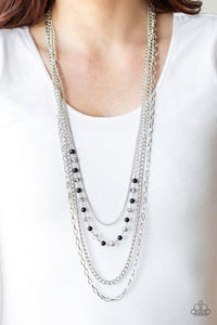 Paparazzi SoHo Sophistication - Black A collection of glistening mismatched silver chains drape across the chest. Dotted with dainty black beads and metallic crystal-like beads, a glittery strand flawlessly drapes across the layers for a timeless finish. Features an adjustable clasp closure.
